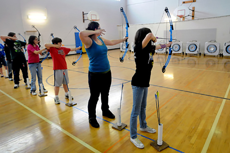 image of young archers training indoors